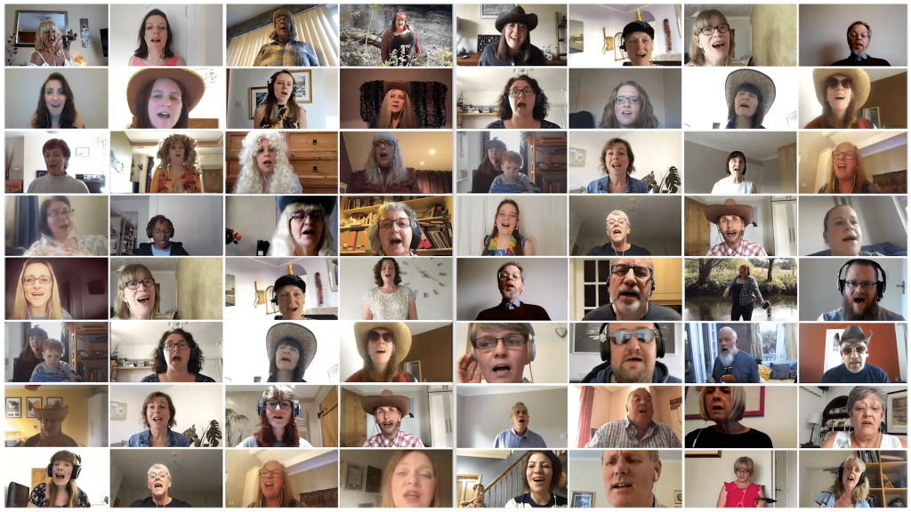 So VIRTUAL Choir! video still from our Islands In The Stream Video. Image shows lots of people arranged in squares, all singing together