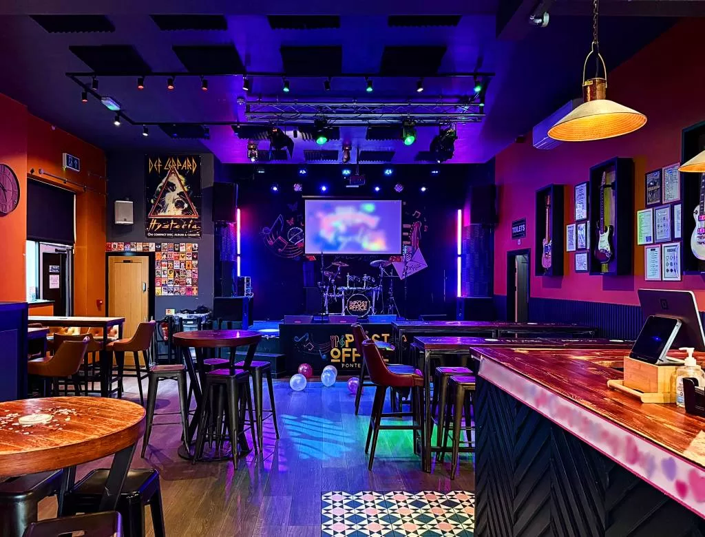 Interior of The Old Post Office in Pontefract, showing the bar, stage and live music area